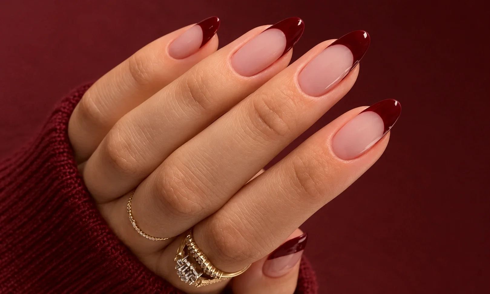 Almond nails with burgundy French tips.