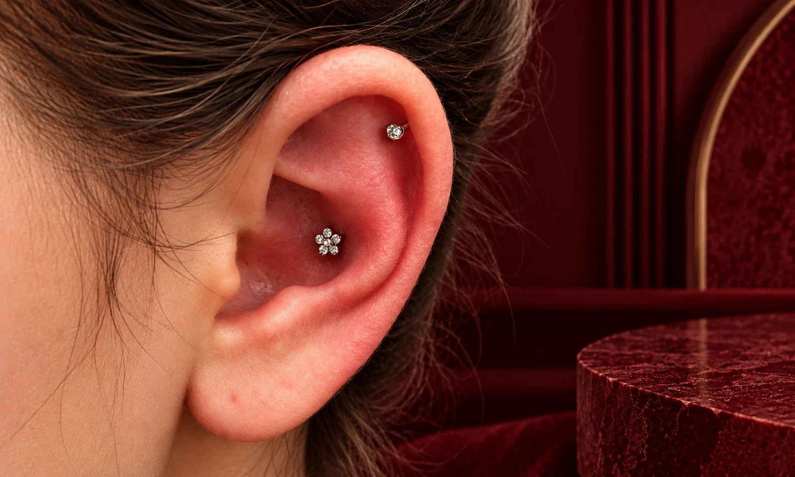 Conch piercing placement with stylish cartilage jewelry.