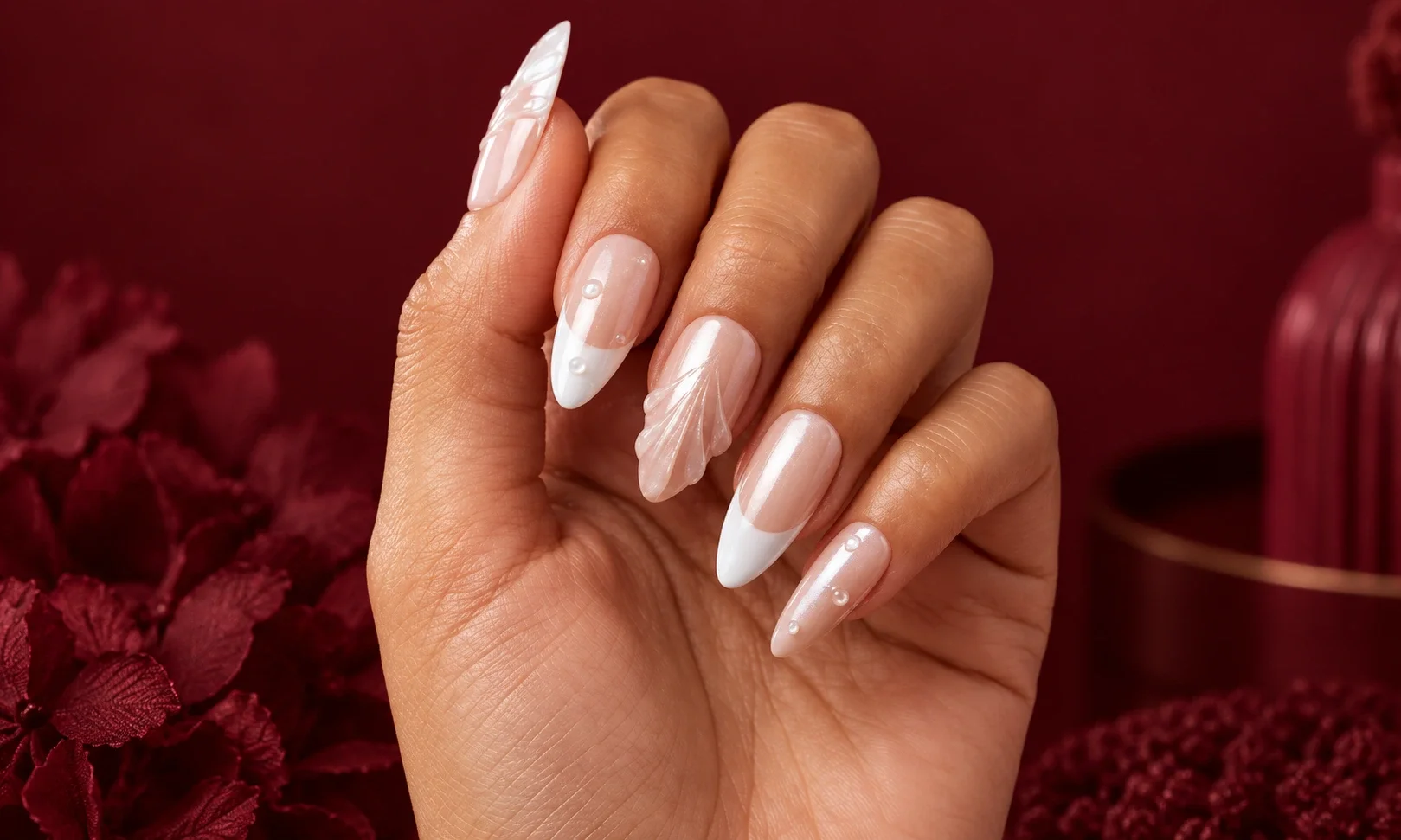 Pearlescent almond nails with white tips.