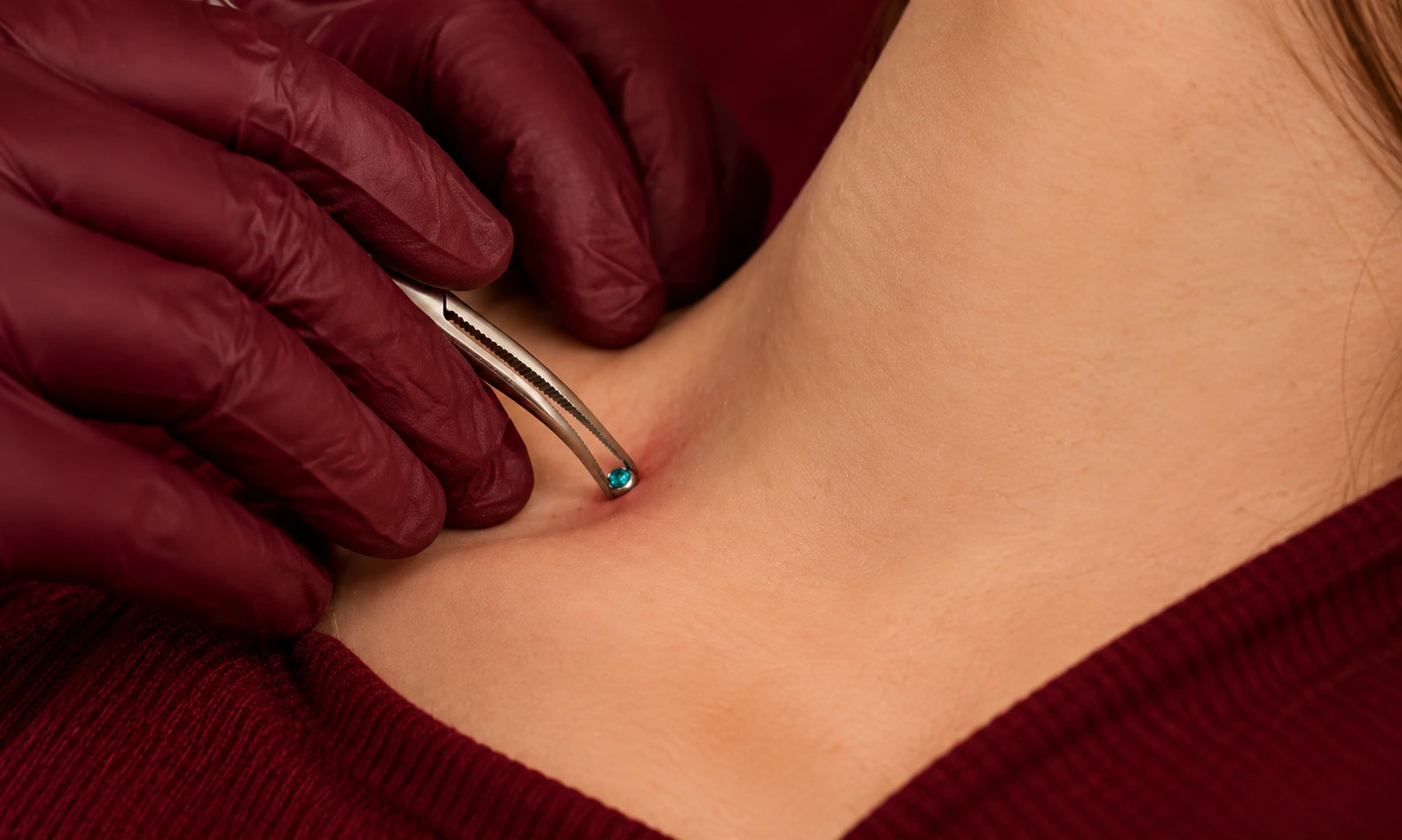 Dermal piercing procedure by a professional piercer