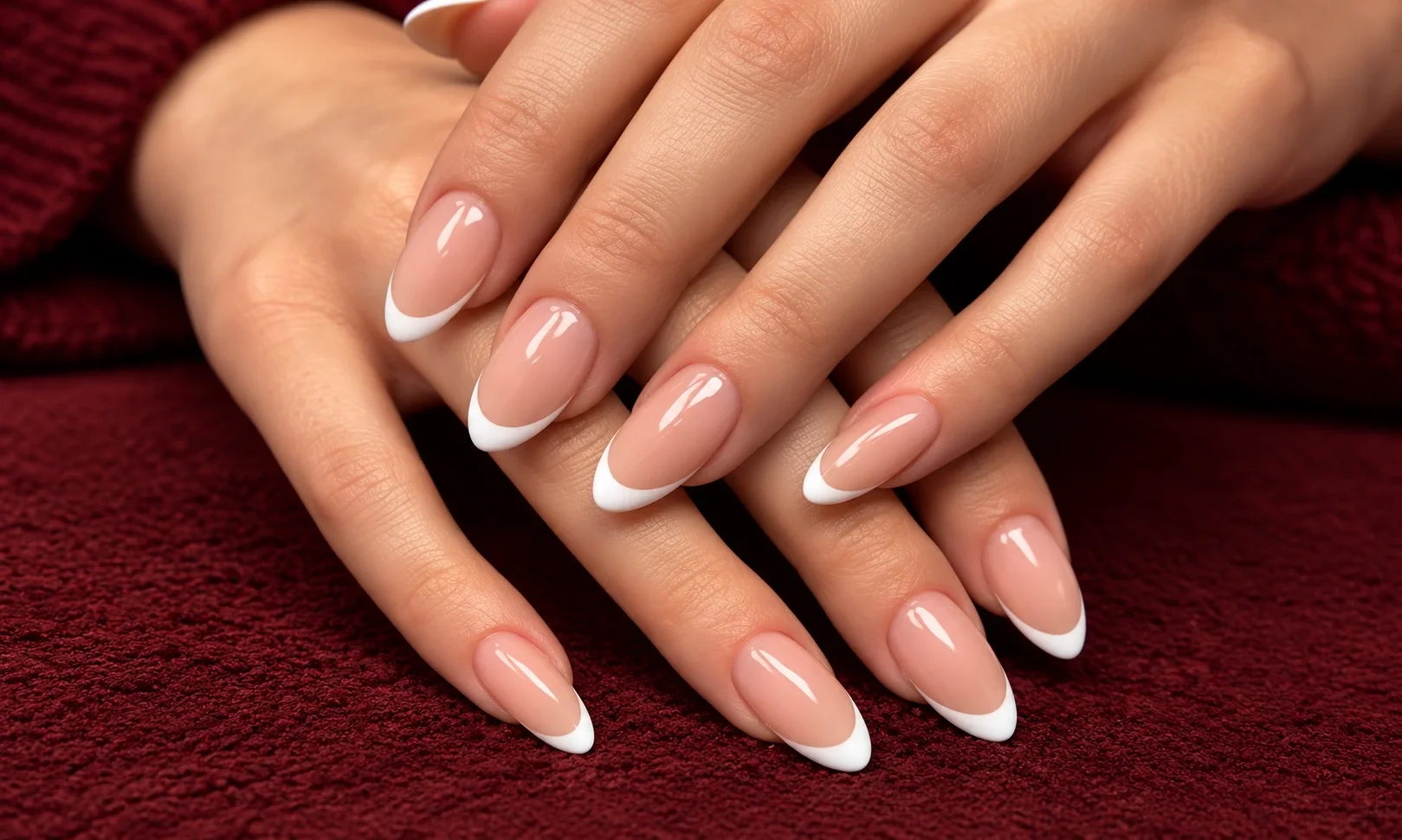 Almond nails with thin white tips.