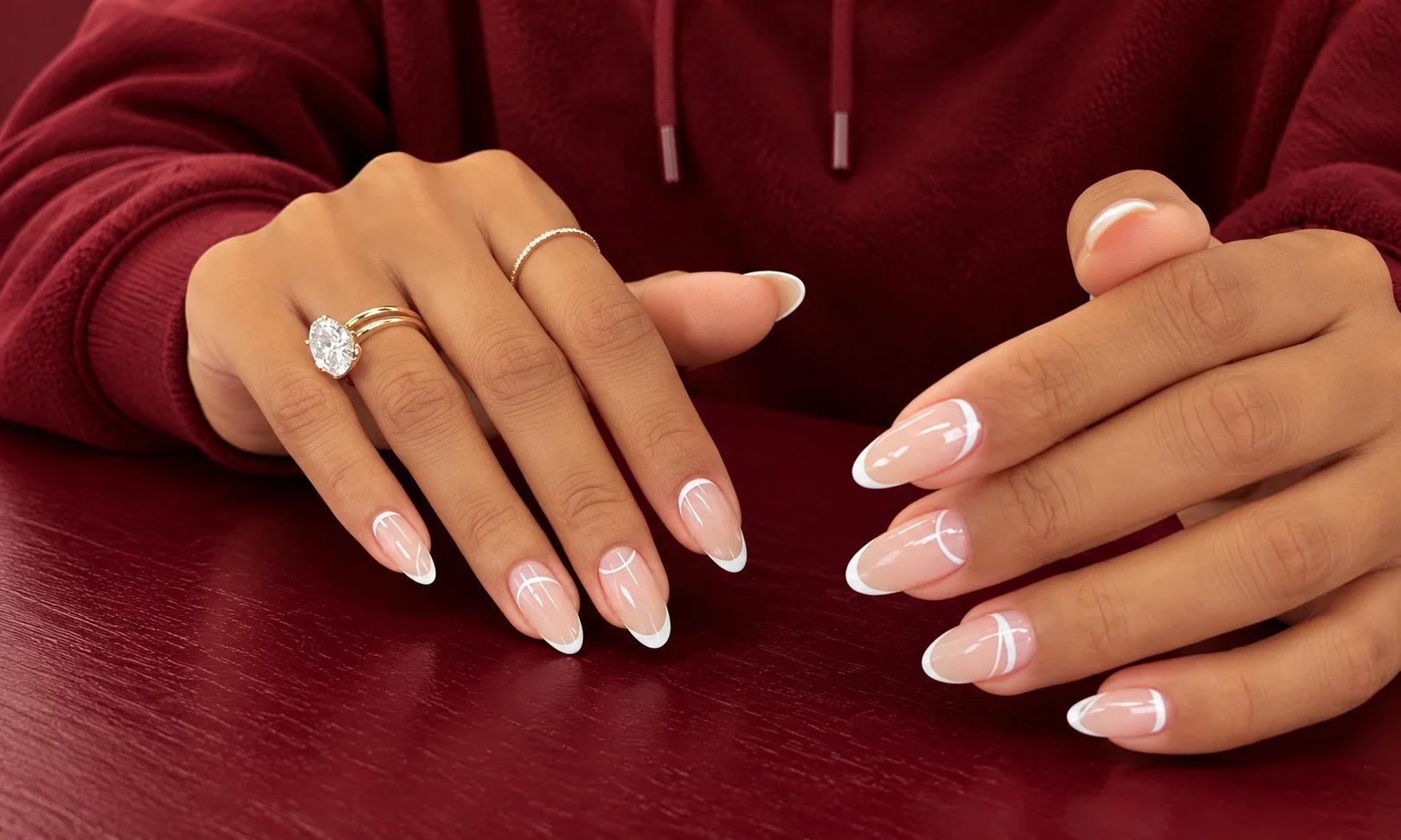 Almond nails with gold crescent cuticle accents.