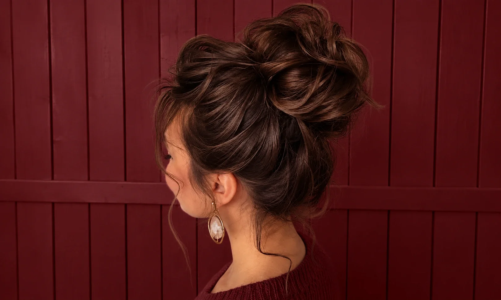 Relaxed messy bun with loose face-framing strands.